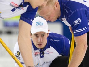 Mat Camm of Team Kean throws a rock as teammates David Mathers, left, and Scott Howard, right, begin to sweep during their final game against Team Epping at the Ontario Curling Championship at the Ontario Curling Championships at the Flight Exec Centre in Dorchester, Ont., on Sunday, Feb. 8, 2015.  Team Kean defeated Team Epping 7-6 in ten ends and will represent Ontario at the national championships. (CRAIG GLOVER / QMI AGENCY)
