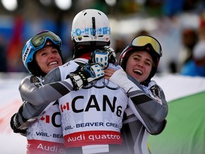 Canada’s Trevor Philp (centre) celebrates with teammates Candace Crawford (left) and Erin Mielzynski during the team event at Golden Peak Stadium during the Alpine World Ski Championships February 10, 2015 in Vail, Col. (Jim Dietz/Getty Images/AFP)
