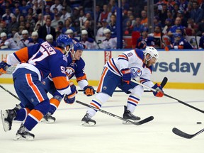 Oilers centre Derek Roy plays the puck during Tuesday's game against the Islanders at the Nassau Coliseum, the Oilers last game at that arena. (USA TODAY SPORTS)