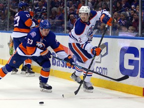 Jeff Petry battles Islanders winger Casey Cizikas during second-period action Tuesday in Uniondale, N.Y. (USA TODAY SPORTS)