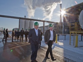 Federal Agriculture Minister Gerry Ritz, left, and chief executive Jim Grey tour the Integrated Grain Processors Co-operative Ethanol Inc. plant in Aylmer, where Ritz announced a $3.7-million investment to help install Canada?s first fibre separation technology system. (DEREK RUTTAN, The London Free Press)