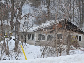 Smoke pours from a house on Escott-Rockport Road as Leeds and the Thousand Islands firefighters battle a fire Tuesday near Rockport.(Nick Gardiner/QMI Agency)