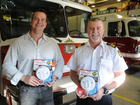 Strathroy-Caradoc Chief Building Official, Matt Stephenson, made a special presentation to Fire Chief Brian George Thursday, Feb. 5, on behalf of the Ontario Building Officials' Association southwest chapter. The OBOA donated $800 to the fire department toward the purchase of some 40 combination smoke and carbon monoxide detectors to be given to families who may not be able to afford purchasing their own. The alarms will be distributed during the fire department's annual smoke alarm program. Firefighters will also be going door to door to conduct a voluntary smoke alarm check, part of their focus on fire prevention. The Ontario Fire Code's new CO alarm regulations came into effect in October of 2014.