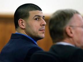 Former New England Patriots football player Aaron Hernandez sits with his defence attorney Charles Rankin during an afternoon session of his murder trial, in Fall River, Massachusetts, February 6, 2015.  (REUTERS)