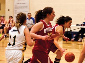Rebecca Lowry drives to the hoop for two of her 25 points. Greg Cowan photo/Pincher Creek Echo