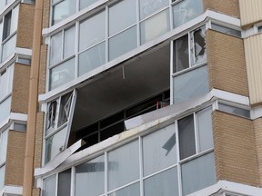The sixth-floor apartment's blown-out windows were visible from street level. (STAN BEHAL/Toronto Sun)