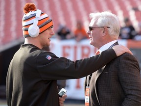 Johnny Manziel #2 of the Cleveland Browns talks with owner Jimmy Haslam prior to the game against the Indianapolis Colts at FirstEnergy Stadium on December 7, 2014 in Cleveland, Ohio. (Jason Miller/Getty Images/AFP)