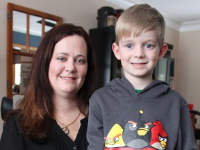 Kerry Henrikson and her son Jonah, 7, pose for a photo at their Sarnia home. Henrikson last year helped start the PANDAS/PANS Ontario group after her son was diagnosed with paediatric autoimmune neuropsychiatric disorders associated with streptococcus. TYLER KULA/ THE OBSERVER/ QMI AGENCY