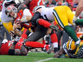 Tampa Bay Buccaneers quarterback Josh McCown reacts as he is sacked by Green Bay Packers linebacker Clay Matthews during NFL play at Raymond James Stadium. (David Manning/USA TODAY Sports)