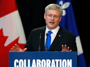 Canada's Prime Minister Stephen Harper speaks during an economic announcement at La Place des Traversees in Roberval, Quebec, June 25, 2014. (REUTERS FILE PHOTO/Mathieu Belanger)