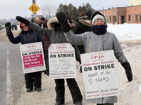 Striking Ontario Nurses Association members picket in front of the Community Care Access Centre during the second week of their work stoppage in Kingston on Wednesday. (Ian MacAlpine/The Whig-Standard)