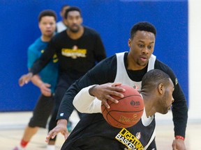 John Hart guards Kurt Alexander during a scrimmage at London Lightning practice at the Central Y on Wednesday.  (CRAIG GLOVER, The London Free Press)