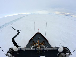 This January 15, 2015 US Coast Guard handout photograph shows the Coast Guard Cutter Polar Star, a heavy icebreaker homeported in Seattle, breaking a parallel channel in the ice beside a previous channel near the National Science Foundation's McMurdo Station, Antarctica.  The US ice-breaking Coast Guard Cutter Polar Star is racing to the rescue of an Australian fishing vessel with 27 people on board stuck in the Antarctic ice.
 AFP PHOTO /  US COAST GUARD / PETTY OFFICER 1ST CLASS GEORGE DEGENER