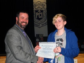 Parkside Collegiate Institute principal Paul Sydor, left, hands an Unsung Hero Award certificate to Grade 11 student Carlie Thompson after a ceremony Wednesday, Feb. 11, 2015 in the school cafeteria. 

Ben Forrest/Times-Journal