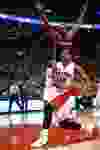 Raptors' DeMar DeRozan passes John Wall enroute to a basket against the Washington Wizards in Toronto, Ont. on Wednesday February 11, 2015. Michael Peake/Toronto Sun/QMI Agency