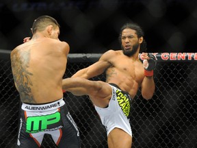 Benson Henderson (red gloves) fights Rafael Dos Anjos (blue gloves) in the Main Event, Lightweight Bout at BOK Center. (Mark D. Smith-USA TODAY Sports)