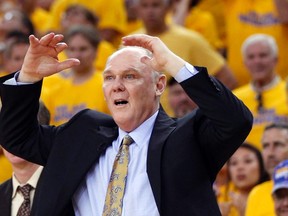 Former Denver Nuggets head coach George Karl reacts against the Golden State Warriors during Game 6 of their NBA Western Conference quarter-final playoff basketball game in Oakland, California May 2, 2013. (REUTERS)