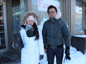 Waterloo Planning Master's students Steven Qi and Xinyue Pi, both of whom are in their first year of the programs, canvass Seaforth on a frigid Thursday, Feb. 12. (Marco Vigliotti/Huron Expositor)