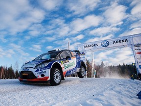 Poland's Michal Solowow and his co-driver Maciek Baran jump with their Ford Fiesta RS WRC during the WRC Rally of Sweden in 2012. (Jonathan Nackstrand/AFP)