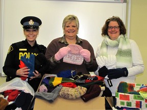 OPP Const. Janine Belanger delivered donations of mittens and other warm clothing to Rhonda Dickson and Capt. Stephanie Watkinson of the Salvation Army on Thursday.