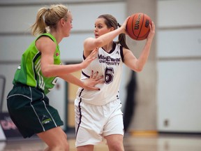 MacEwan University Griffins forward Megan Carr gets ready to make a pass against a University of Northern British Columbia player during a game in January. (Len Joudry, MacEwan)
