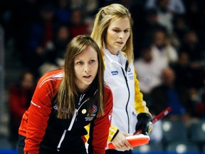Ontario skip Rachel Homan (left) and Manitoba skip Jennifer Jones look on during the gold-medal game at the Scotties Tournament of Hearts in Kingston, February 24, 2013.  (REUTERS/Mark Blinch)