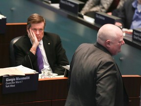 Toronto Mayor John Tory with Councillor Rob Ford on Wednesday, Feb. 11, 2015 during a council meeting at City Hall. (Veronica Henri/Toronto Sun)
