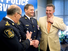 London police chief designate John Pare, middle, shares a laugh with retiring Chief Brad Duncan, left, and former chief Murray Faulkner. (CRAIG GLOVER, The London Free Press)