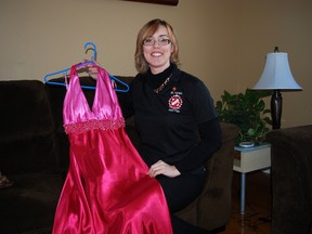 Karen Coutts holds a dress she plans to donate to the Kinette Club of Elgin-St. Thomas' second-annual Second Dance: Dress Re-sale in March. The club is asking people to donate prom, bridesmaid and graduation dresses for the re-sale, which will benefit local charities. (Ben Forrest, Times-Journal)