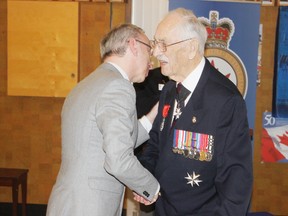 Local WWII veteran Lt. Col. Bill Anderson is congratulated by Jean-François Casabonne Masonnave, the Consul General of France in Toronto after receiving the county’s Legion of Honour Medal at a special ceremony held at the Royal Canadian Legion branch 109 in Goderich on Feb. 8. (Dave Flaherty/Goderich Signal Star)
