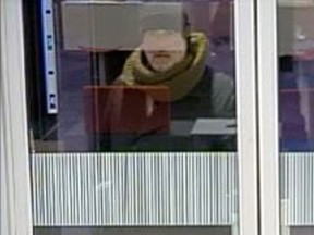 Ottawa Police are seeking this man in connection with a bank robbery Feb. 12 at a Bank St. bank branch. (OTTAWA POLICE submitted image)