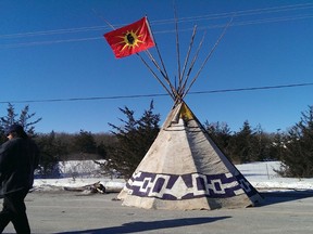 A tent sits in the middle of Hinchey Road on Tyendinaga Territory after protesters erected two barricades Monday, March 3, 2014. Protesters are demanding an inquiry into the hundreds of missing Native women across the country. (Jerome Lessard/QMI Agency)