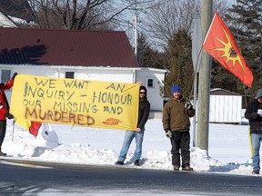 Walpole Island members held a protest at the corner of Highway 40 and Dufferin Avenue in Wallaceburg on Friday, to make people aware of the large number of Canada’s murdered and missing indigenous women and call on the federal government to create an independent inquiry to look into the issue. (DAVID GOUGH/ QMI Agency)