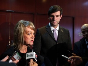 Minister of Municipal Affairs,Diana McQueen (l) and Mayor Don Iveson speaks to the media at the Sutton Hotel in Edmonton, Alta. on Friday February 13, 2015. McQueen and Iveson was attending the Mayors and Reeves meetings. Perry Mah/Edmonton Sun