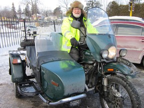 Motorcycle riders by the thousands normally converge on Port Dover on Friday the 13th. Bikers, however, were in short supply on Friday, Feb. 13, 2015 due to the extreme winter cold. One of the exceptions was the multi-layered Brian Smith of St. Thomas. He made the pilgrimage to Norfolk County aboard a two-wheel drive motorcycle that was manufactured in Siberia. MONTE SONNENBERG / QMI Agency