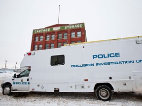 An Edmonton Police Service collision investigation unit is seen near 102 Street and 105 Avenue, where Tyson Boskoyous was struck in a hit-and-run on Dec. 2, 2013. He later died. (Ian Kucerak/Edmonton Sun file)