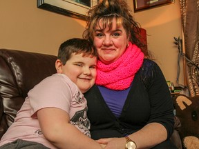 Six-year-old Jace Davidson with his mother Jennifer Kehoe in their home in Kingston, Ont. on Thursday January 29, 2015. After Davidson faced a serious incident of bullying in November, Kehoe felt that how the situation was handled is what led her family to moving him to another school board. Julia McKay/The Kingston Whig-Standard/QMI Agency