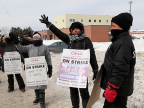 Striking Ontario Nurses Association members picket in front of the Community Care Access Centre during the second week of their work stoppage in Kingston on Feb. 11. The ONA and CCAC have agreed to arbitration ending the 16-day long strike.  (Ian MacAlpine/The Whig-Standard)