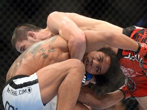 Benson Henderson (red) and Rustam Khabilov (blue) fight during their lightweight bout at UFC Fight Night 42 at Tingley Coliseum. (Joe Camporeale-USA TODAY Sports)
