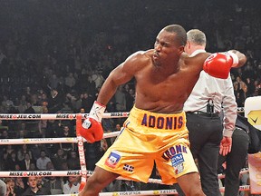 Adonis Stevenson, celebrating his win over Dmitry Sukhotskiy at the Colisee last December, will have to defend his title on April 4 in Quebec City instead of Toronto because of an Ontario hand-wrap rule that has been called “silly.” (QMI Agency photo)