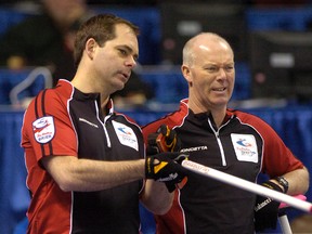 Third Richard Hart (left) and skip Glenn Howard watch play at the Tim Hortons Brier on Monday March 7, 2011 at the John Labatt Centre in London. (SUE REEVE/THE LONDON FREE PRESS/QMI AGENCY)