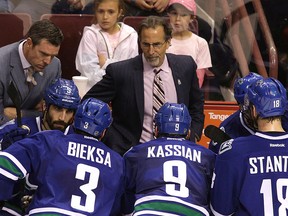 Vancouver Canucks coach John Tortorella talks to the players during their NHL game against the Calgary Flames at Rogers Arena in Vancouver, B.C. on Sunday April 13, 2014. (Carmine Marinelli/Vancouver 24hours/QMI Agency)