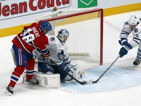 Montreal Canadiens center Daniel Briere (48) reaches for the puck against Toronto Maple Leafs goalie Jonathan Bernier (45) as defenseman Dion Phaneuf (3) defends during an over time period at Bell Centre on March 1, 2014.(Jean-Yves Ahern-USA TODAY Sports)