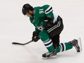 Stars forward Tyler Seguin slowly gets up after being hit by Dmitry Kulikov of the Panthers during third period NHL action in Dallas on Friday, Feb. 13, 2015. (Tom Pennington/Getty Images/AFP)