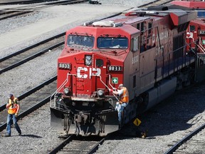 A Canadian Pacific Railway crew works on a train at the CP Rail yards in Calgary, April 29, 2014. (TODD KOROL/Reuters)