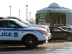 Police vehicles parked outside the Halifax Shopping Center, which was named by police as the intended target of a potential attack in Halifax, Feb. 14, 2015. (DARREN PITTMAN/Reuters)