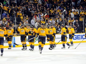 Nashville Predators players celebrate after a 3-2 win against the New York Rangers on Feb. 7, 2015, at Bridgestone Arena in Nashville. (CHRISTOPHER HANEWINCKEL/USA TODAY Sports)