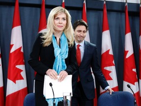 Member of Parliament Eve Adams, left, and Liberal leader Justin Trudeau arrive at a news conference in Ottawa February 9, 2015. (REUTERS/Chris Wattie)