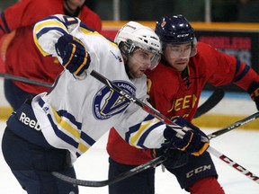 Laurentian Voyageurs forward Christopher Smith battles Queen's Gaels forward Harrison Hendirx during OUA men's hockey playoff action at Gerry McCrory Countryside Sports Complex in Sudbury on Saturday. Ben Leeson/The Sudbury Star