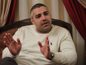 Al-Jazeera journalist Mohamed Fahmy gives an interview in Cairo on Feb. 14, 2015 after he and his colleague Egyptian producer Baher Mohamed were released from an Egyptian jail on Feb. 12.  (AFP PHOTO/HASAN MOHAMED)